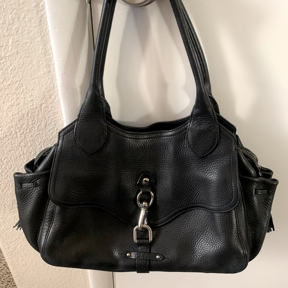 Beautiful Cole Haan handbag ! Lots of storage and beautiful leather .